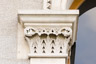 Carved floral capital at windows